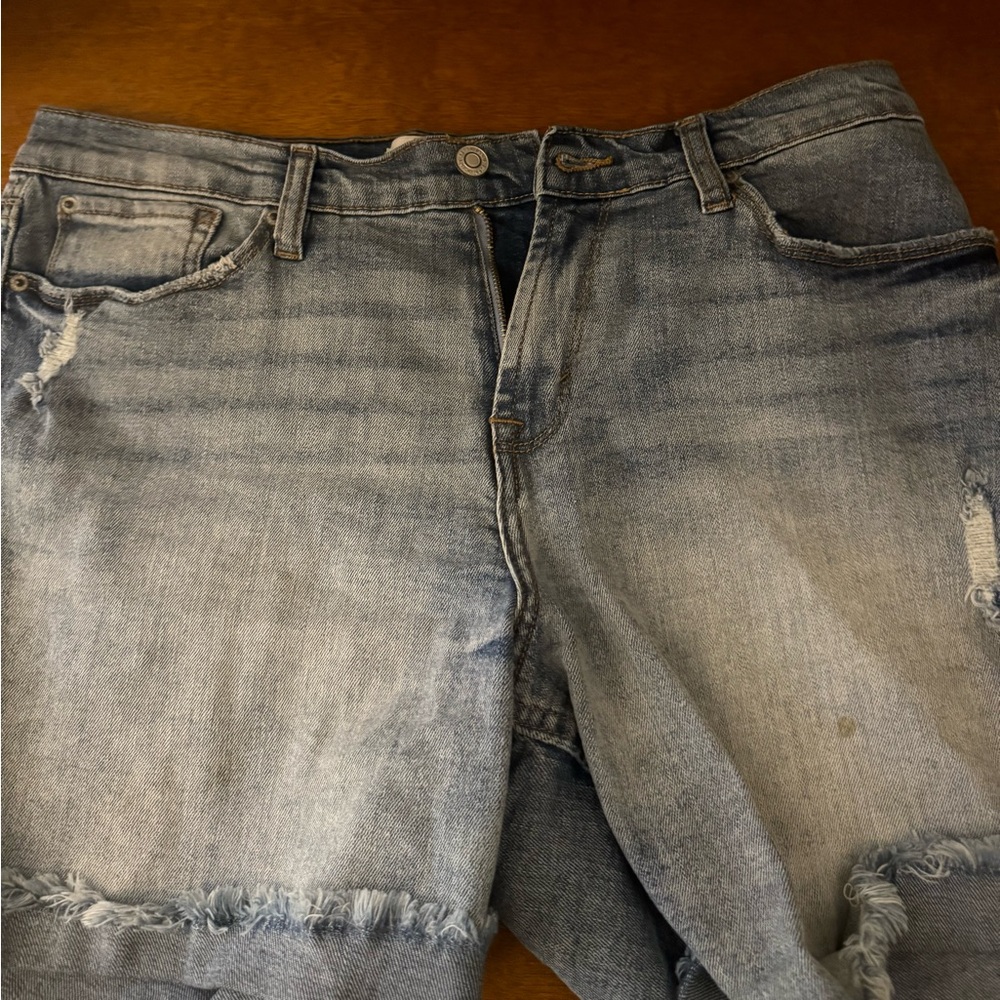 Light blue distressed denim jeans with a baggy fit